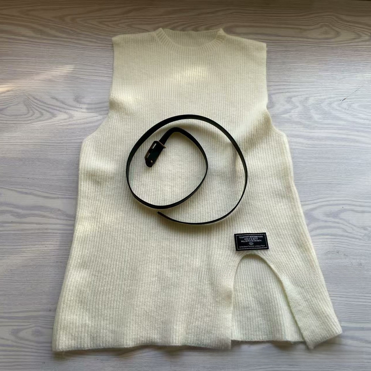 A two-piece loose knitted vest and shirt set for women