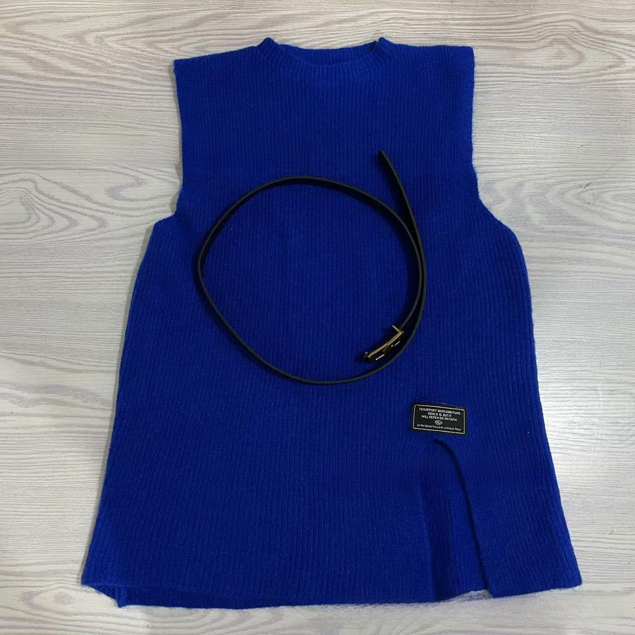 A two-piece loose knitted vest and shirt set for women