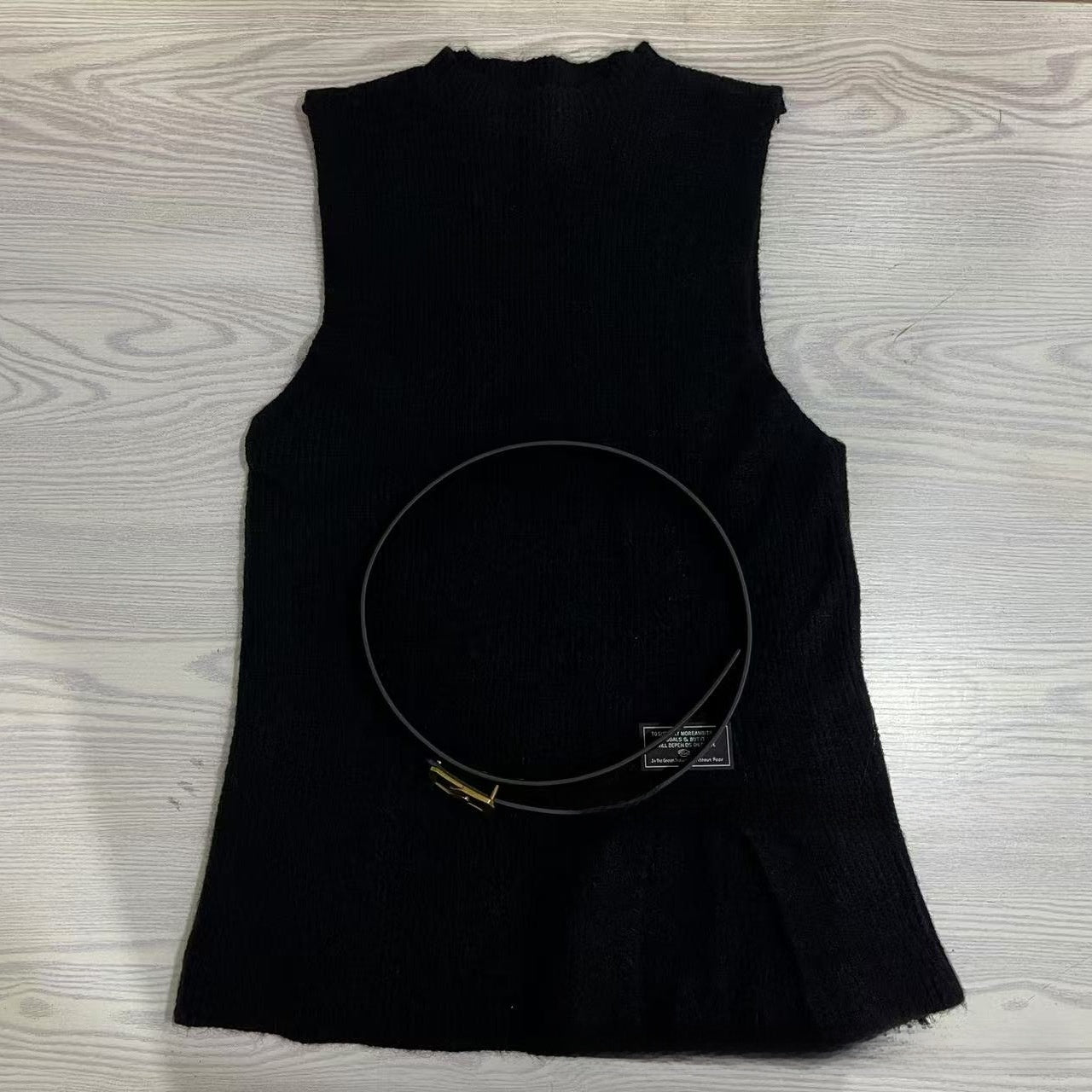 A two-piece loose knitted vest and shirt set for women